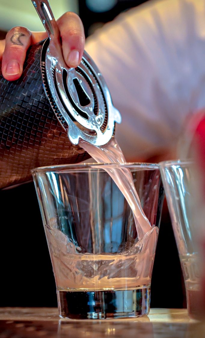 Bartender serving drink 
